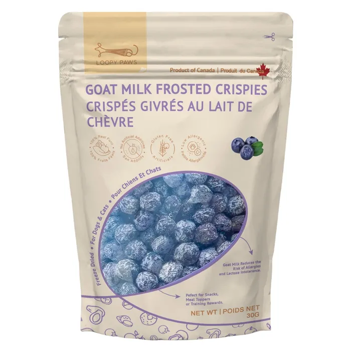 A bag of Logi Paw's Goat Milk Frosted Crispies for pets, featuring a clear window showing round treats, blueberry images, and bilingual English-French text on a white and purple resealable pouch.