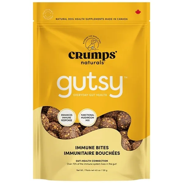 A yellow package of Crumps' Naturals Gutsy Immune Bites dog treats, labeled as functional mushroom mix for immune health, with bite-sized treats shown at the bottom of the bag.