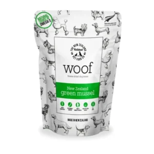 A white pouch of Woof brand New Zealand green mussel freeze-dried dog treats. The packaging features illustrations of different dog breeds and highlights natural Omega-3 and the product being made in New Zealand. The pouch has a green band and natural elements.