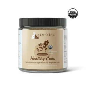 Jar of Kin+Kind Healthy Calm herbal supplement for dogs and cats, featuring an organic certification seal.