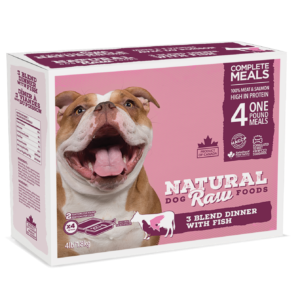Natural Dog Raw Foods 3 Blend Dinner with Fish 4 lbs features high-protein, complete meals made with 100% meat and salmon. The pink and white box showcases a happy brown and white dog on the packaging.