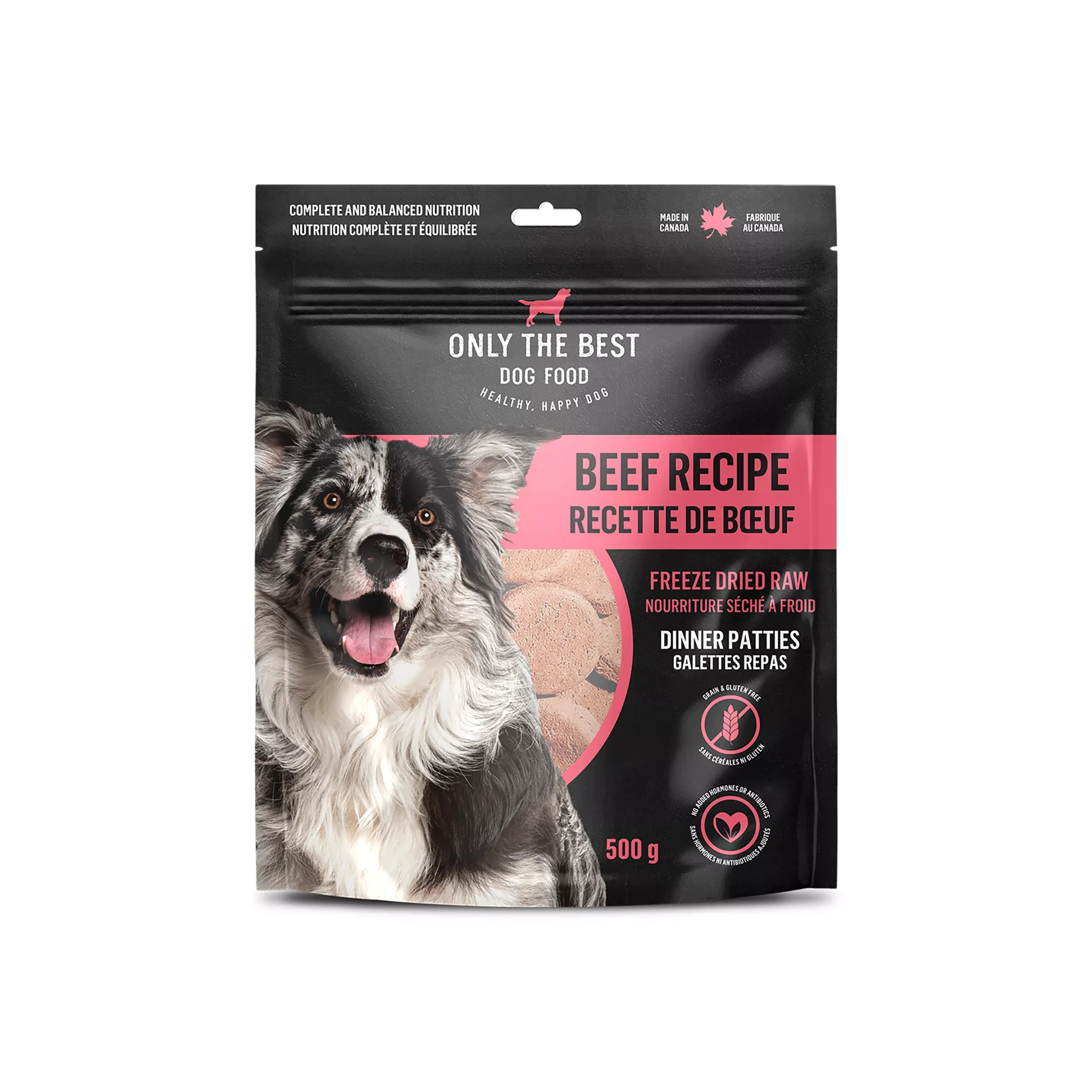 A black and white dog is pictured on the front of a 500g bag of "Only The Best Dog Food" freeze-dried raw beef recipe dinner patties. The packaging is black and pink with feeding and nutritional information.
