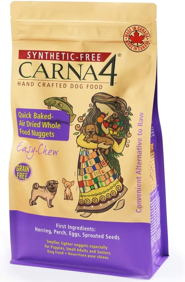 Purple and beige bag of Carna4 dog food labeled as synthetic-free and grain-free. Features images of a dog, fish, and a woman holding a basket. Highlights quick-baked, air-dried whole food nuggets with herring, perch, eggs, and sprouted seeds.