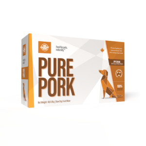 A rectangular box labeled "Big Country Raw Pure Pork 4x1lb" displays an orange geometric dachshund and white text. The box highlights single protein pork and includes pet food branding details.