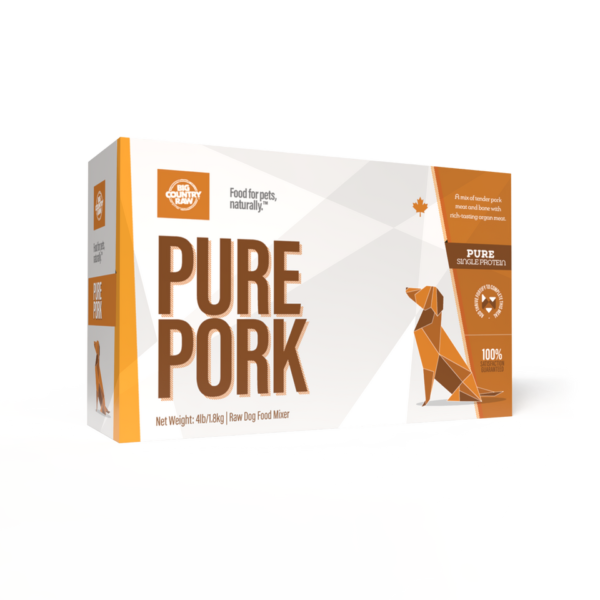 A rectangular box labeled "Big Country Raw Pure Pork 4x1lb" displays an orange geometric dachshund and white text. The box highlights single protein pork and includes pet food branding details.