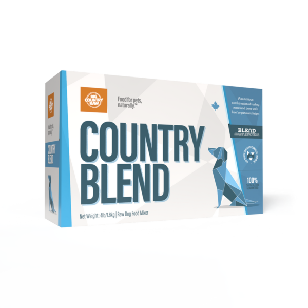A box of Big Country Raw Country Blend 4x1lb features a blue geometric dog on a white background and is labeled as a natural food mixer for pets, net weight 4lb/1.81kg.