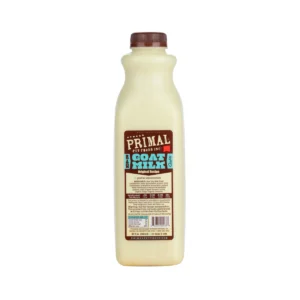 A plastic bottle of Primal Pet Foods Goat Milk, featuring a brown cap and brown label with text detailing the original recipe. The label includes nutritional information and brand design in white, blue, and brown colors.