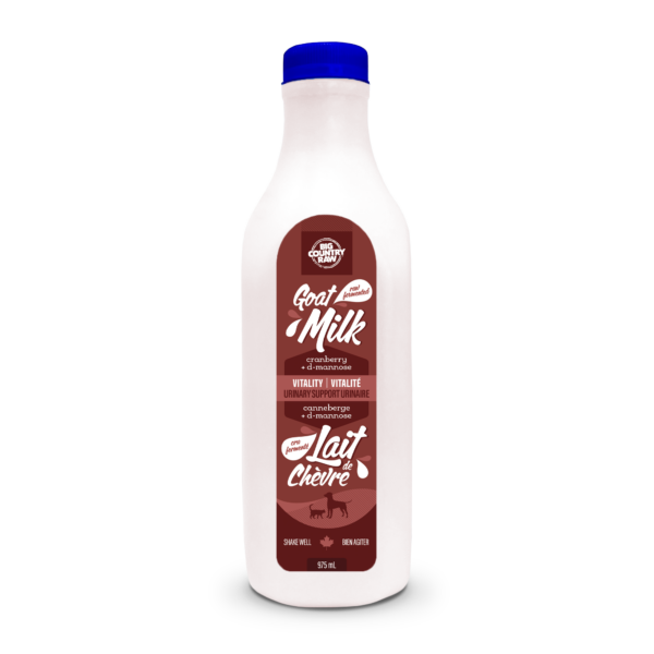 A plastic bottle of goat milk with a blue cap. The label is maroon and white, featuring text in English and French, and an image of a goat. The bottle is 975 mL, and the label highlights cranberry flavor and contains nutritional information.