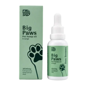 A green and white box and dropper bottle of "Duo Senses Essentials Extra Strength 3000mg" pet hemp oil, featuring a large paw print image, labeled full spectrum hemp extract, 30ml, for X-Large pets.