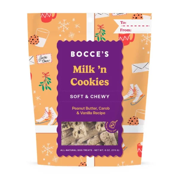 A package of Bocce's Milk 'n Cookies dog treats in peanut butter, carob, and vanilla flavor. The bag is orange with festive winter illustrations and a purple label. A small gift tag is printed on the upper right corner.