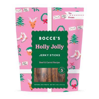 Dog treat package with a pink holiday-themed design featuring reindeer, ice skates, and Christmas trees. The label reads "Bocce's Holly Jolly Jerky Sticks, Beef & Carrot Recipe." The package has space for "To" and "From" details.