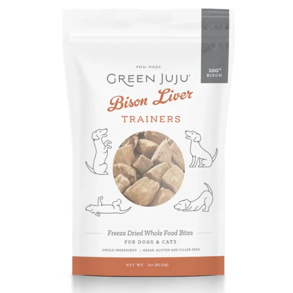 A white bag of Green Juju Freeze Dried Trainer Bison Liver 85 gr for dogs and cats. The front of the bag features a cut-out window showing the freeze-dried treats inside, along with playful line drawings of a dog and cat. The bag states it contains 3 oz (85.05 g) of treats.