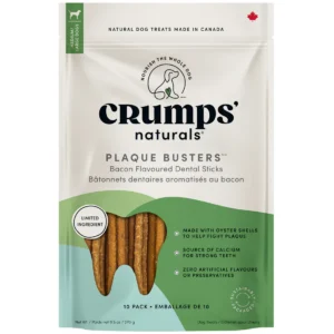 A turquoise and white bag of Crumps' Naturals Plaque Busters Bacon Flavoured Dental Sticks for dogs, showing several brown dental sticks inside. The package highlights natural ingredients and dental health benefits.
