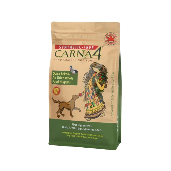 A beige and green bag of Carna4 synthetic-free dog food with an illustration of a woman and a dog. It features quick-baked, air-dried whole food nuggets and highlights ingredients like duck and seeds. Grain-free and suitable for various dog breeds.