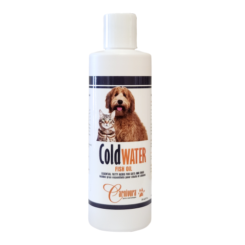 A white bottle of Cold Water Fish Oil with a label showing a dog and a cat. The product is by Carnivora and is intended for pets.