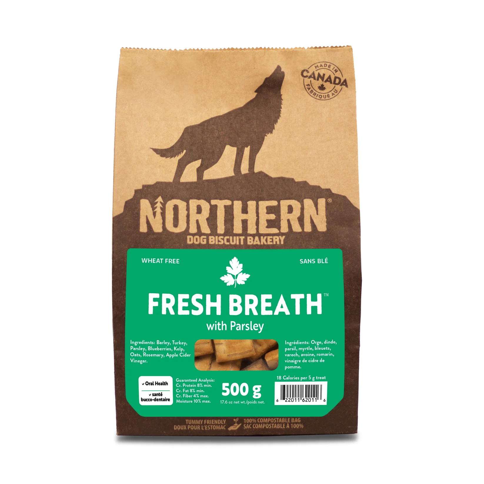 A brown paper bag of Northern Dog Biscuit Bakery treats labeled "Fresh Breath with Parsley." The packaging features a silhouette of a howling wolf and green accents, with a weight of 500g.