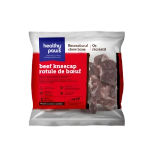 A package of Healthy Paws beef kneecap recreational chew bone, featuring clear branding and a photo of the bone pieces inside. The label highlights it as a Canadian product with red and white colors.