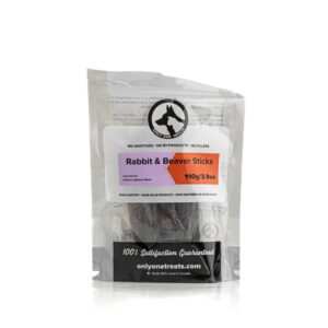 A package of "Only One Treat Rabbit & Beaver Sticks 110 g" dog treats, weighing 3.9 oz, features clear packaging that emphasizes the absence of additives and ensures 100% satisfaction guaranteed, all presented on a crisp white background.