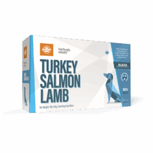 A rectangular box of Big Country Raw Turkey/Salmon/Lamb 4x1lb raw dog food mixer, with geometric dog artwork, blue and white design, net weight (4lb/1.8kg), and labeled as 100% natural ingredients.