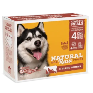 A rectangular package of Natural Raw Foods for dogs featuring a picture of a happy husky. The box advertises "Complete Meals," "4 One Pound Meals," "3 Blend Dinner," and "100% Beef & Poultry High in Protein." The weight is 4 lbs (1.8 kg).