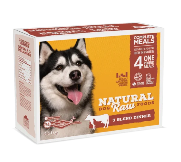 A rectangular package of Natural Raw Foods for dogs featuring a picture of a happy husky. The box advertises "Complete Meals," "4 One Pound Meals," "3 Blend Dinner," and "100% Beef & Poultry High in Protein." The weight is 4 lbs (1.8 kg).