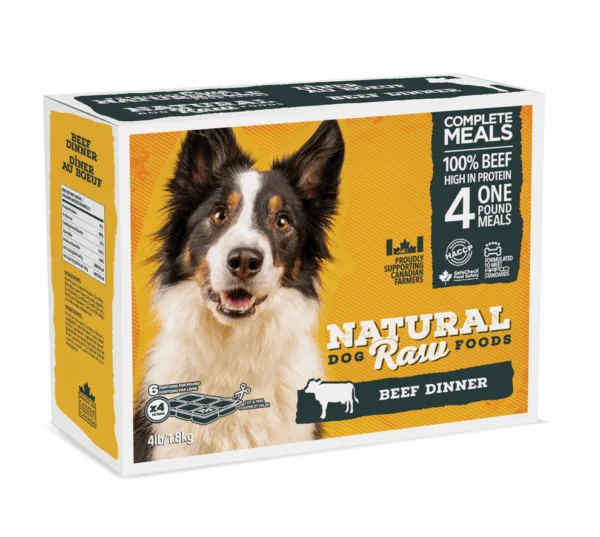 A bag of Natural Dog Raw Foods featuring a happy black and white dog on the front. The product is a beef dinner complete meal, containing 100% beef, high in protein. The packaging indicates it includes four 1-pound meals and has a weight of 4 lb (1.81 kg).