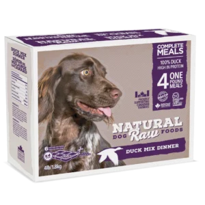 Image of a box of Natural Raw Foods Complete Meals for dogs, featuring a duck mix dinner. The box highlights the main ingredients: 100% duck, high in protein. It contains 4 one-pound meals (1.8 kg total). The packaging shows a happy dog and several quality certifications.