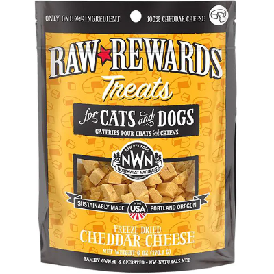 A package of Raw Rewards treats for cats and dogs. The bag is labeled "Only One Ingredient" and "100% Cheddar Cheese." It shows small cubes of freeze-dried cheddar cheese and states "Sustainably Made" in Portland, Oregon.