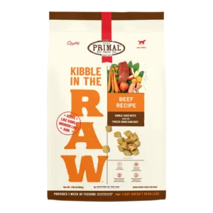 A package of Primal Pet Foods' "Kibble in the Raw" Beef Recipe. It features kibble-sized bites with freeze-dried raw beef. The bag emphasizes quality ingredients for dogs and highlights benefits such as nourishment and raw nutrition.