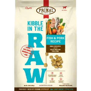 The Primal Kibble in The Raw Fish & Pork Recipe 1.5 lb packaging features vibrant images of vegetables, fish, and pork, underscoring the natural raw nutrition in kibble-sized bites, with a focus on quality ingredients similar to traditional kibble.