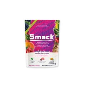 A colorful bag of Smack cat food labeled "Purrfect Pork Recipe." The package features images of fruits, vegetables, and a cat, and highlights that the food is raw, dehydrated, and made with natural ingredients.