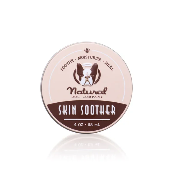 Tin of "Natural Dog Company Skin Soother" balm, 4 oz (118 mL). The label features a dog illustration and the words "Sooth, Moisturize, Heal" on a light pink background.