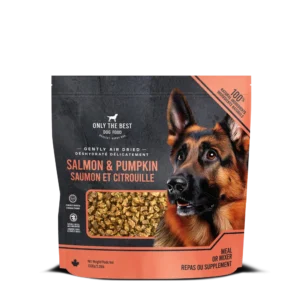 A bag of Only the Best dog food, salmon and pumpkin flavor, with an image of a German Shepherd and a window showing the dried food pieces. Text is in English and French.