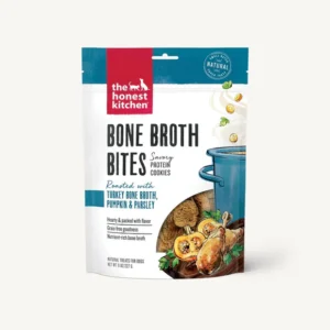 A package of The Honest Kitchen Bone Broth Bites dog treats, featuring illustrations of turkey, pumpkin, parsley, and a blue cooking pot on the front. The packaging highlights natural ingredients and protein content.