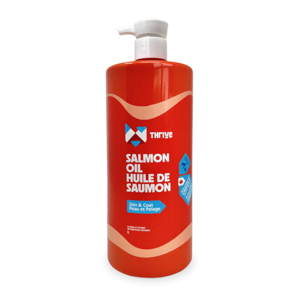 A large red bottle with a white pump, labeled "Thrive Salmon Oil 500 ml," promotes skin and coat health. The packaging includes English and French text.