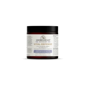 A jar of Adored Beast Apothecary Vital Defense, featuring cellular balance and longevity formula for dogs. It has a white label with black text and a black lid. The product weighs 17.6 oz (500g) and is made in Canada.