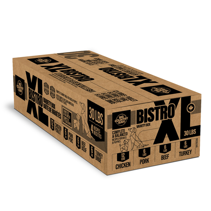 A large brown box labeled "Big Country Raw XL Bistro 30 lb" features bold black "30 lbs" text and icons for chicken, pork, beef, and turkey—the included meats.