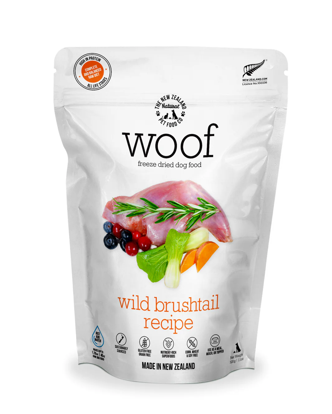 A package of Woof freeze-dried dog food, wild brushtail recipe. The front displays an image of meat, rosemary, blackberries, cranberries, carrots, and pumpkin. It is labeled "Made in New Zealand" and includes authenticity badges.