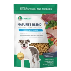 A bag of Dr. Marty’s Nature’s Blend Sensitivity Select adult dog food, featuring a photo of a dog and illustrations of raw meat and produce ingredients.