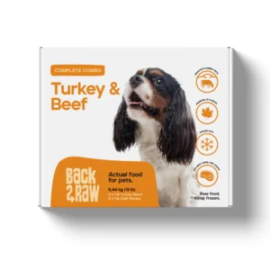 A Back2Raw Beef & Turkey 12lbs (Complete) pet food box displays a dog photo and benefit icons. The label says, "Actual food for pets. Pure food. Keep frozen.