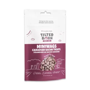 A bag of Tilted Barn Pet Co. Miniwags Canadian Bacon Treats for dogs, featuring an image of the treats and text in English and French on a white and maroon package.