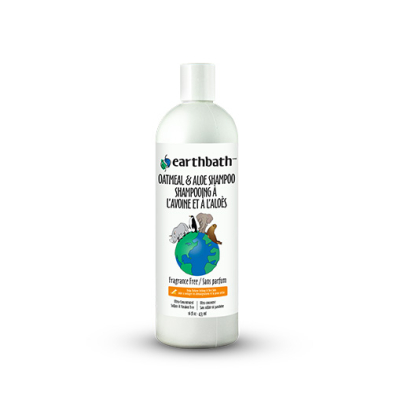 A white bottle of Earthbath Oatmeal & Aloe Shampoo with green and brown label. The label features a cartoon dog and cat on top of a globe and says “Fragrance Free” in English and French.