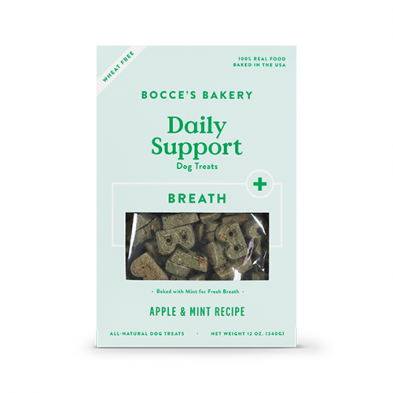 A package of Bocce's Bakery Daily Support dog treats, featuring an apple and mint recipe for fresh breath. The packaging is light green with product details and a clear window showing the treats inside.