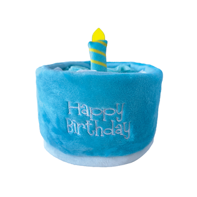 A plush blue birthday cake toy with "Happy Birthday" embroidered on the front and a blue and yellow striped candle on top, shown against a white background.