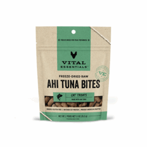 A brown and green resealable bag of Vital Essentials Freeze-Dried Raw Ahi Tuna Bites cat treats. The packaging highlights that it is grain and gluten-free, made with ahi tuna, and rich in protein.