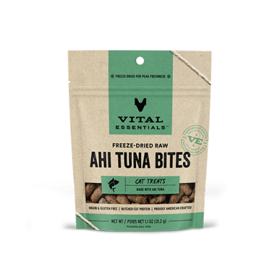 A brown and green resealable bag of Vital Essentials Freeze-Dried Raw Ahi Tuna Bites cat treats. The packaging highlights that it is grain and gluten-free, made with ahi tuna, and rich in protein.