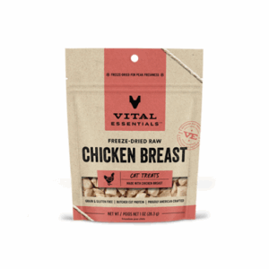 A beige and pink bag of Vital Essentials Freeze-Dried Raw Chicken Breast Cat Treats, featuring product branding and a window showing the treats inside. The bag is labeled grain and gluten free.