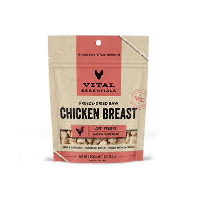 A beige and pink bag of Vital Essentials Freeze-Dried Raw Chicken Breast Cat Treats, featuring product branding and a window showing the treats inside. The bag is labeled grain and gluten free.