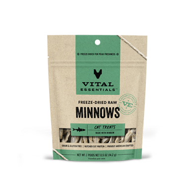 A brown and green resealable bag of Vital Essentials Freeze-Dried Raw Minnows cat treats, showing small fish inside the package. The label highlights that the product is grain and gluten free.