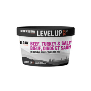 A tub labeled "Iron Will Raw Level Up" pet food, featuring beef, turkey, and salmon in natural juices. The label has English and French text, with a black lid and a mostly white and purple design.